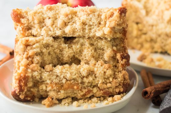 Easy Apple Streusel Coffee Cake fall dessert recipe just perfect for Fall! This soft, moist cake is easy to make because it starts with a box mix that you doctor up with apples and a crunchy cinnamon streusel topping. 