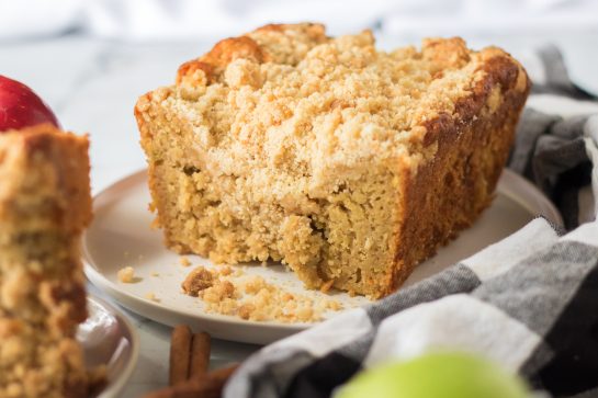Simple Apple Streusel Coffee Cake fall dessert recipe just perfect for Fall! This soft, moist cake is easy to make because it starts with a box mix that you jazz up with apples and a crunchy cinnamon streusel topping. 