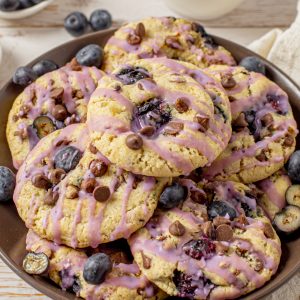 Blueberry Oatmeal Chocolate Chip Cookies are deliciously thick, soft, and chewy oatmeal cookies that are perfectly spiced and stuffed full of fresh blueberries!