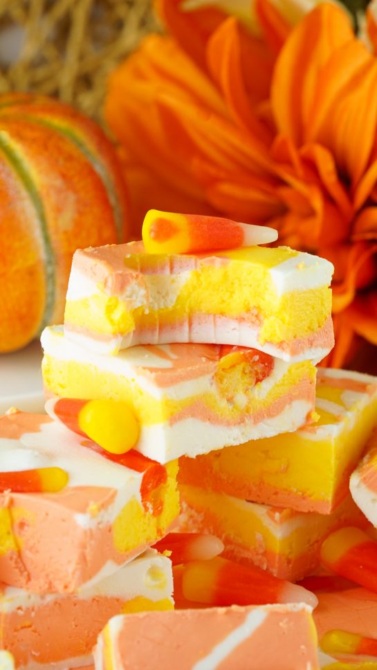 Close-up of the No-Bake Candy Corn Fudge recipe that is a delicious and fun Halloween or fall treat for kids and adults. This creamy homemade fudge only needs 4 ingredients and 15 minutes to make!