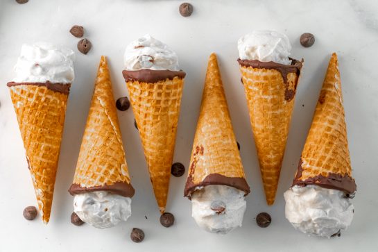 Easy Ice Cream Cannoli Cones recipe is a cute twist on the classic Italian dessert recipe! The cannoli cream is super easy to make with just 5 ingredients! Perfect for holidays and birthdays!
