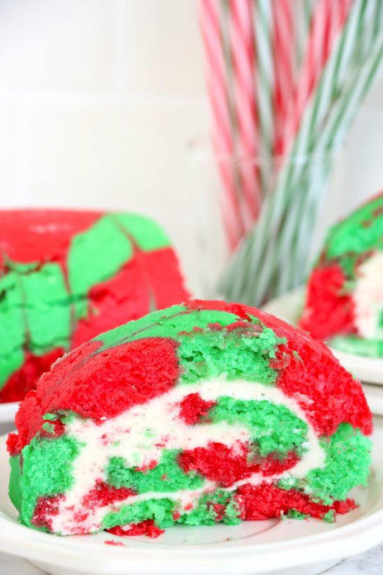 Christmas Cake Roll is a beautiful Holiday Dessert recipe or Treat for your friends and family! This cake is easy to make for the holidays and a fun twist on traditional cake, with the colors and look of Christmas!