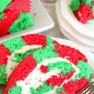 Christmas Cake Roll is the perfect Holiday Dessert recipe or Treat for your friends and family! This cake is easy to make for the holidays and a fun twist on traditional cake, with the colors and look of Christmas!