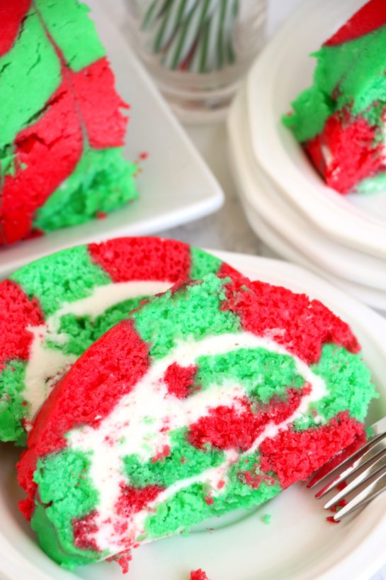 Christmas Cake Roll is the perfect Holiday Dessert recipe or Treat for your friends and family! This cake is easy to make for the holidays and a fun twist on traditional cake, with the colors and look of Christmas!