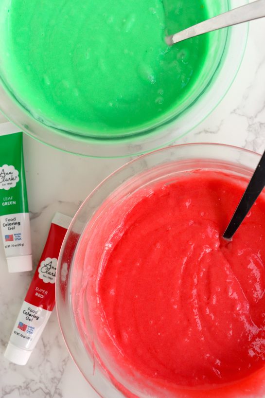 Mixing the gel food coloring into the cake batter to make this Christmas cake roll recipe