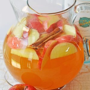 Pumpkin Sangria for a Crowd is a sweet, spiced, and full of fall flavors for the holiday season! This Pumpkin Sangria is perfect for autumn, Halloween pumpkin carving nights, Thanksgiving, or fall party!