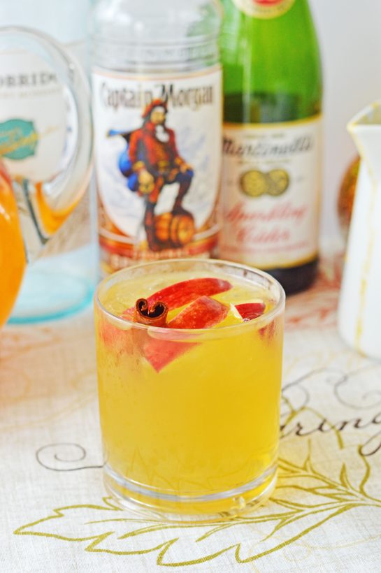 Pumpkin Sangria for a Crowd is a sweet, spiced, and full of fall flavors for the holiday season! This Pumpkin Sangria is perfect for autumn, Halloween pumpkin carving, Thanksgiving, or anytime!