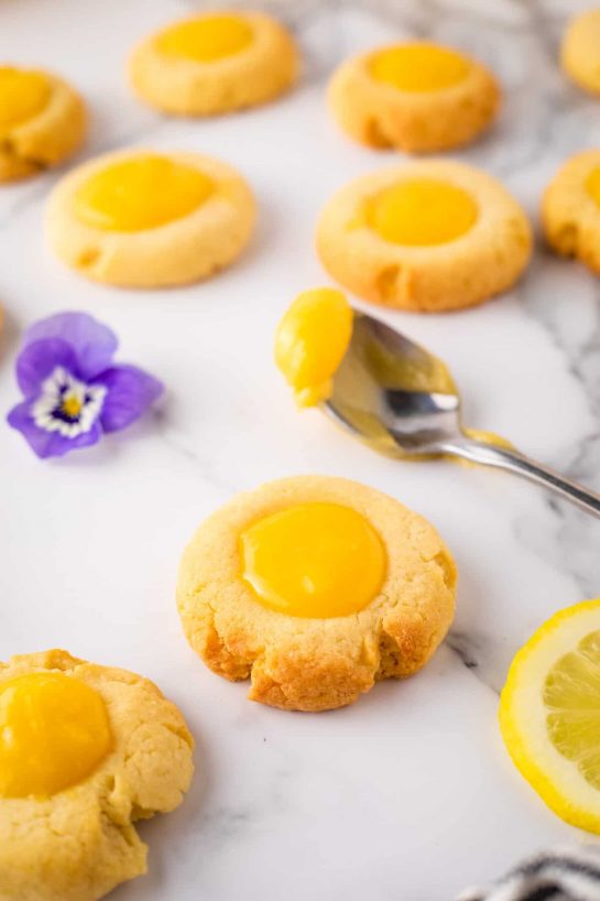 Lemon Curd Thumbprints recipe. If you love lemon flavor then make a batch of these thumbprints asap! They are so colorful and tasty!
