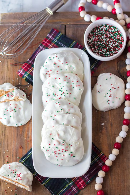 No-Bake Polar Bear Claws are a delicious Christmas treat and classic candy recipe for the winter holidays! The luscious caramel and salty roasted peanuts are coated in a silky white chocolate coating. I top them with sprinkles for a festive touch. 