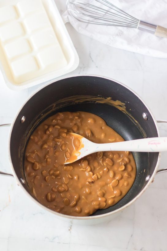 Melting the caramels and mixing in peanuts needed to make the No-Bake Polar Bear Claws recipe