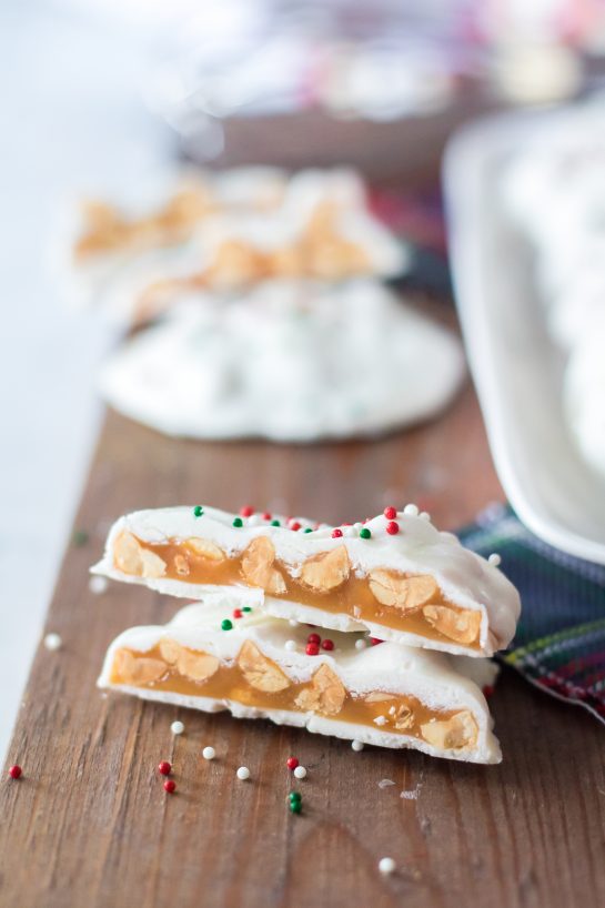 Easy, No-Bake Polar Bear Claws are a delicious Christmas treat and classic candy recipe for the winter holidays! The luscious caramel and salty roasted peanuts are coated in a silky white chocolate coating. I top them with sprinkles for a festive touch. 