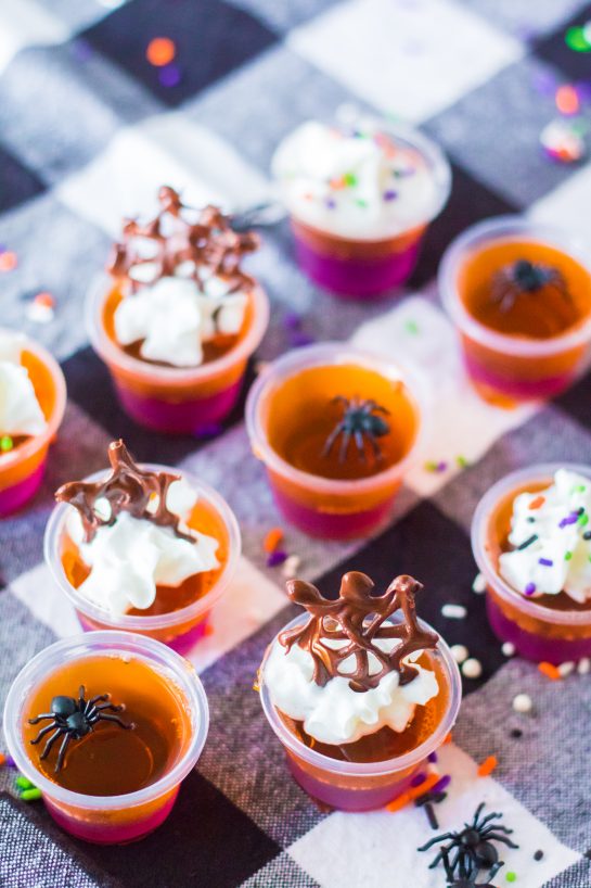 This recipe for Halloween Jello Shots are a colorful, fun Halloween party ideas. Learn how to make these cute boozy shots because they will be a cocktail party favorite.
