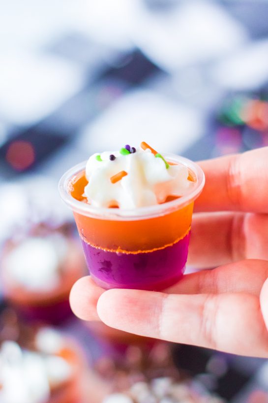 This recipe for boozy Halloween Jello Shots are a colorful, fun Halloween party ideas. Learn how to make these cute Halloween shots because they will be a cocktail party favorite.