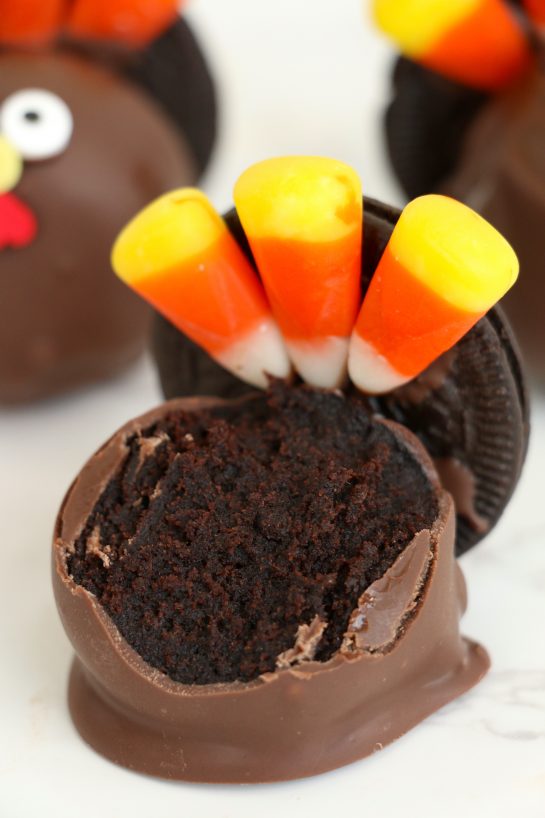 Putting the candy on the cake balls for the Easy Turkey Cake Pops recipe