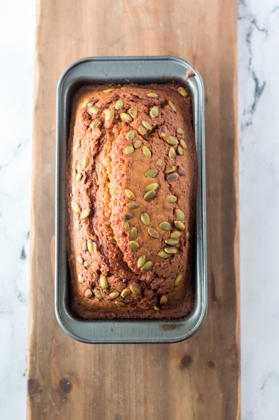 Maple-Glazed Pumpkin Bread is an easy holiday recipe teaching you how to make a moist, fresh pumpkin bread from scratch. This bread is drizzled with a simple maple glaze and each slice of this bread is perfect.