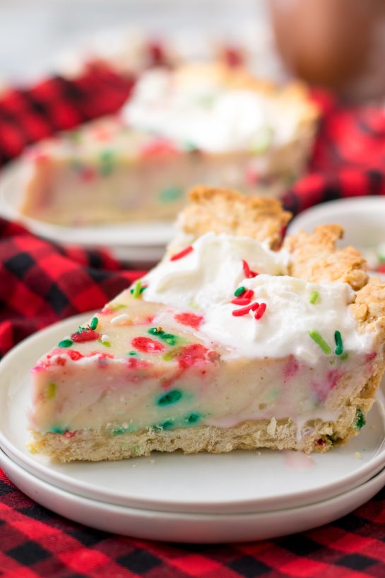 This Christmas Sugar Cream Pie recipe is my favorite for the holidays. This is a delicious creamy pie decorated with holiday sprinkles for a festive look. The filling is silky and rich - perfect for any occasion. The crust is a no-roll pie crust which makes it fabulous to throw together for the busy holiday season. 