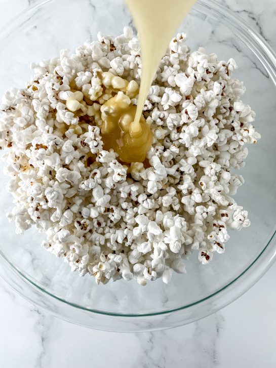 Mixing the ingredients needed to make New Year Champagne Popcorn Balls recipe