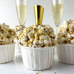 New Year Champagne Popcorn Balls are so sticky, tasty, and everyone will love them. They’re the perfect snack recipe for any party, holiday or get together, but especially New Year's Eve dish to pass!