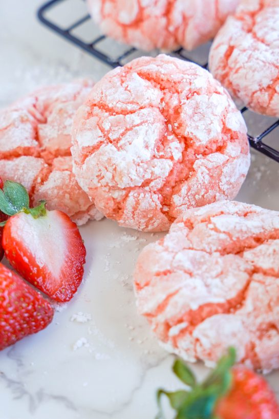 Strawberry Crinkle Cookies: an easy and delicious strawberry cookie recipe for Valentine's Day made with cake mix. If you're looking for the easiest cookie recipe on the planet, you found it! These cookies require just FIVE ingredients and come out amazing every time.