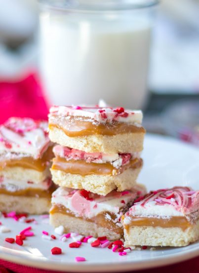 This recipe for Valentine's Day Millionaire Bars is always such a treat for the holiday.  Perfect, buttery, tender shortbread is topped with a thick layer of gooey caramel and then topped off with a layer of chocolate and sprinkles.  