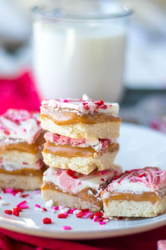 This recipe for Valentine's Day Millionaire Bars is always such a treat for the holiday.  Perfect, buttery, tender shortbread is topped with a thick layer of gooey caramel and then topped off with a layer of chocolate and sprinkles.  