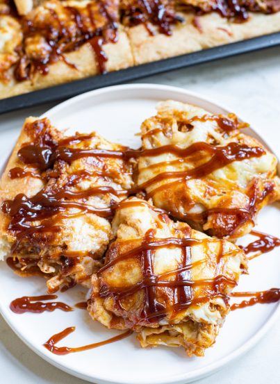 Sheet Pan BBQ Chicken Pizza has a crispy crust, tons of cheese, and tender chicken, with the sweetness of hickory barbecue sauce. It’s a snap to make!