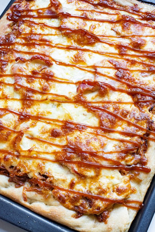 Sheet Pan BBQ Chicken Pizza has a crispy crust, tons of cheese, and tender chicken, with the sweetness of hickory barbecue sauce. It’s a so easy to make!