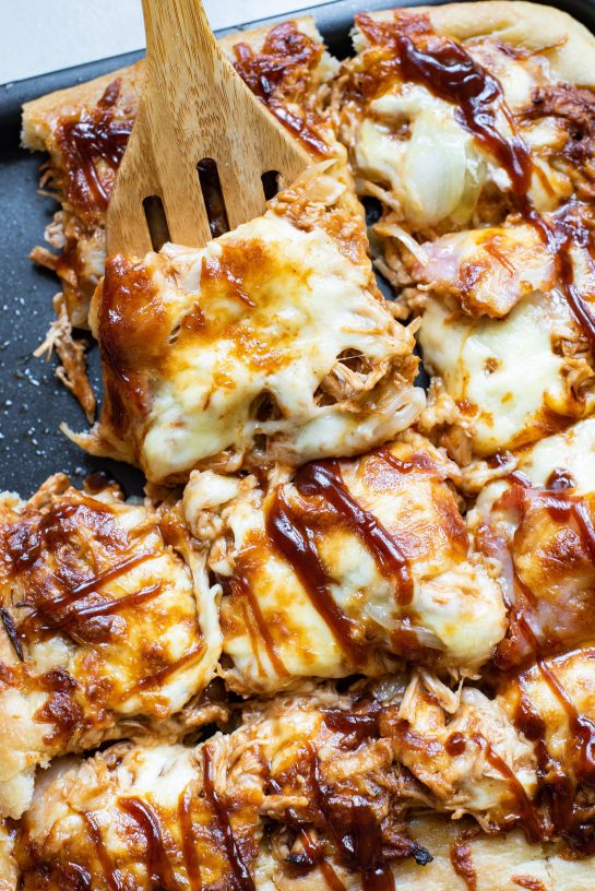 Easy, sweet and savory Sheet Pan BBQ Chicken Pizza has a crispy crust, tons of cheese, and tender chicken, with the sweetness of hickory barbecue sauce. It’s a so easy to make!