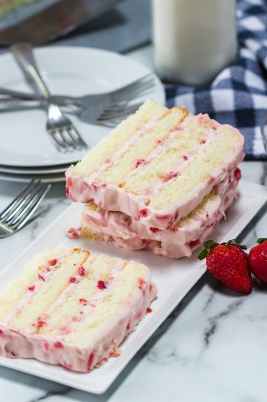 The sliced Strawberries & Cream Layered Cake recipe ready to be served for Easter dessert or a special occasion.