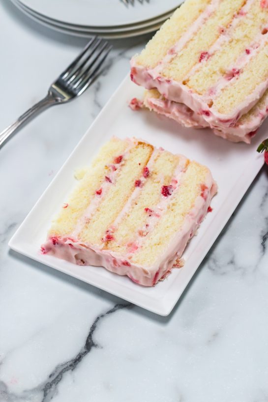The sliced Strawberries & Cream Layered Cake recipe ready to be served for Easter dessert.