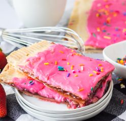 Sheet Pan Strawberry Poptarts is a great dessert recipe everyone will love. Pie Crust and strawberry jam give this dessert it's famous pop-tart flavor. These pop tarts are filled with REAL strawberry jam and topped with an sprinkles. 