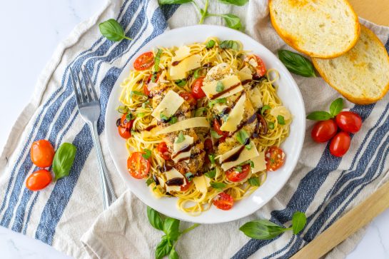 Bruschetta Chicken Pasta recipe with a simple but flavorful bruschetta, seasoned chicken, and balsamic glaze that brings the whole dish together. Easy spring or summer dinner recipe!