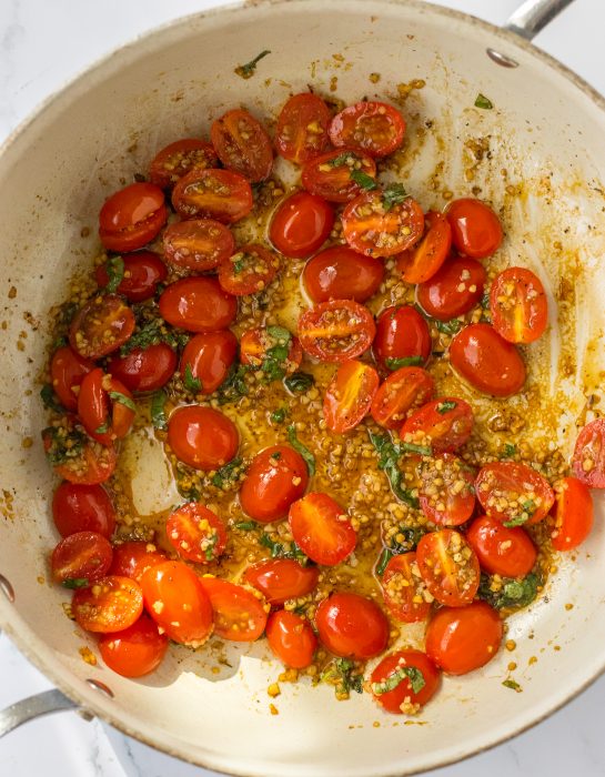 Roasting the tomatoes in the pan to make the Bruschetta Chicken Pasta recipe 