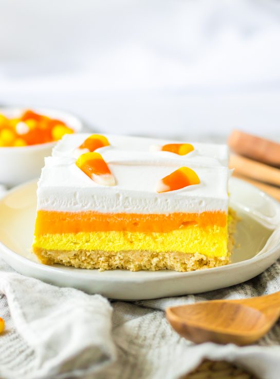 Layers of vanilla cookies, a creamy cheesecake layer and a vanilla pudding layer all colored to look like candy corn. Candy Corn Lush recipe is always a favorite at parties and is a make-ahead fall Halloween dessert that’ll make all ghouls go wild!