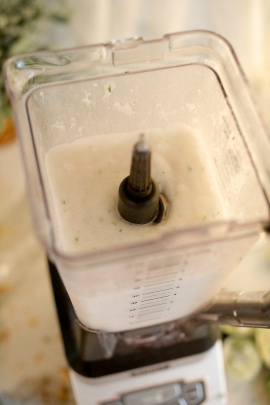 Blending the Coconut Lime Frozen Margaritas recipe in the blender