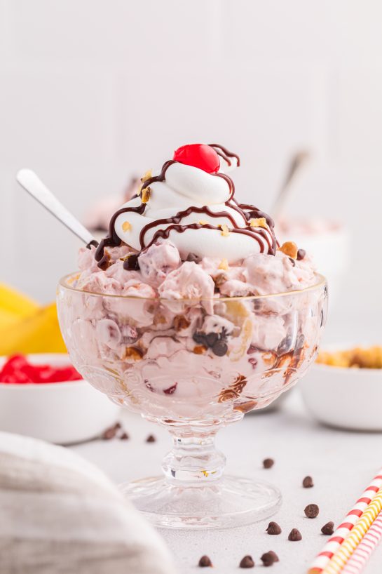 Banana Split Fluff Salad is a quick and easy recipe that turns a classic ice cream treat into a deliciously creamy “dump and go” dessert salad or side dish for a party or picnic!