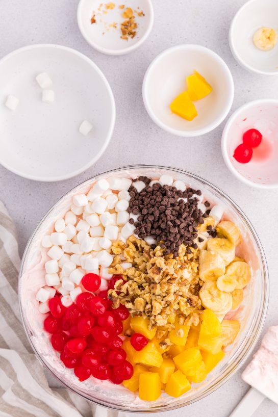 Mixing the ingredients needed to make the Banana Split Fluff Salad recipe