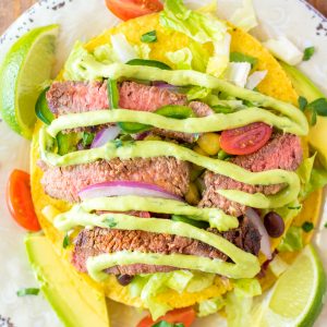 Steak Tostada Salad recipe has a Mexican twist and is the steak salad of your dreams! It's loaded with a juicy steak, your favorite veggies, and a creamy cilantro-lime vinaigrette. It makes a delicious healthy lunch or dinner salad!