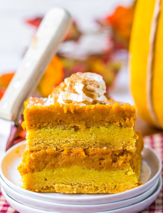 Pumpkin Gooey Butter Cake recipe is always a classic and I swear it is better than pumpkin pie.  It is even better than pumpkin pie and always a favorite in Fall and around the holidays.  A simple crust made from a yellow cake mix get topped with the most luscious pumpkin filling of pumpkin, butter, cream cheese and powdered sugar. A sprinkle of powdered sugar and a dollop of whipped cream makes this cake a showstopper.