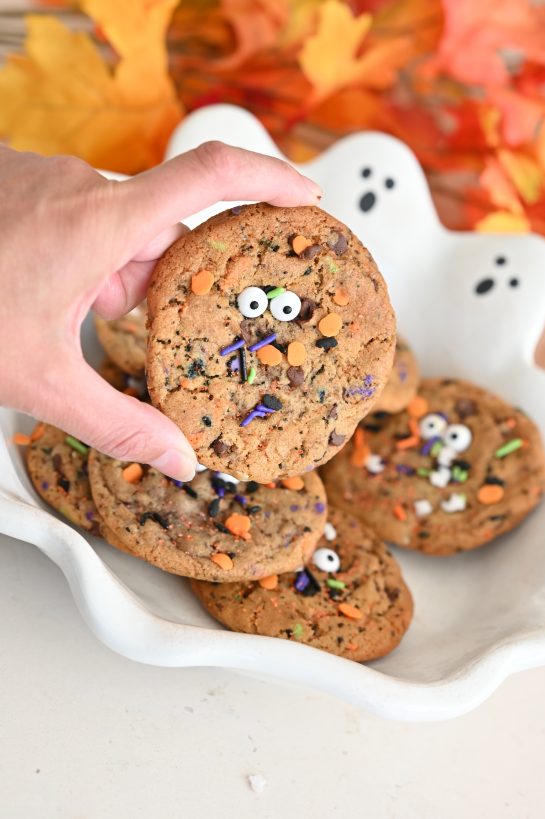 Halloween Monster Chocolate Chip Cookies recipe: the perfect blend of crisp edges and chewy centers, bursting with rich buttery flavor and gooey chocolate chips. Topped with playful candy eyes and a sprinkle of festive colors, they’re not just a treat—they’re a fun and spooky centerpiece for any Halloween celebration.