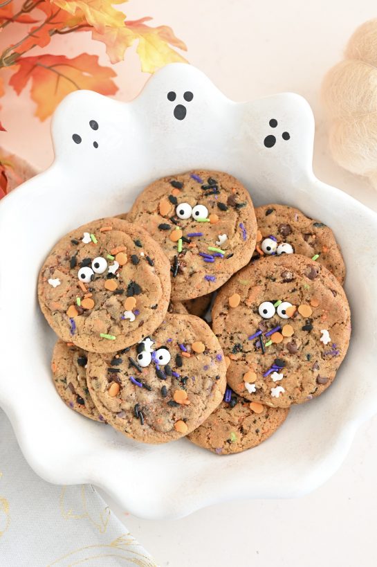 Easy Halloween Monster Chocolate Chip Cookies recipe: the perfect blend of crisp edges and chewy centers, bursting with rich buttery flavor and gooey chocolate chips. Topped with playful candy eyes and a sprinkle of festive colors.