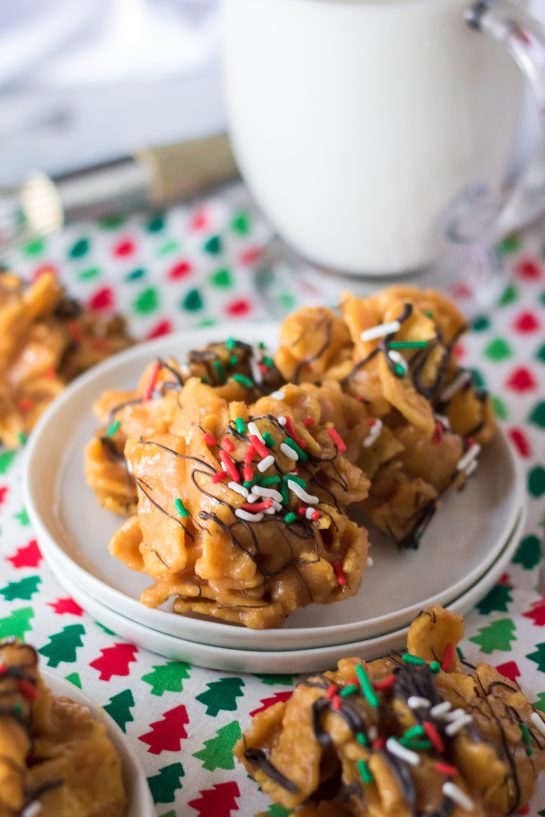 Frito Candy recipe is a creamy, gooey base of peanut butter candy gets tossed with salty Fritos for a fabulous treat for Christmas.  You will drizzle them with chocolate and top them with sprinkles and they are perfect for a Christmas dessert tray or gifting.