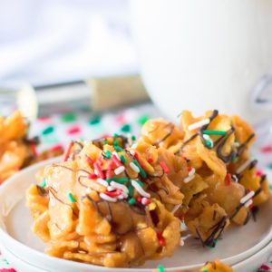 Frito Candy recipe is a creamy, gooey base of peanut butter candy gets tossed with salty Fritos for a fabulous treat for Christmas.  You will drizzle them with chocolate and top them with sprinkles and they are perfect for a holiday dessert tray or gifting.