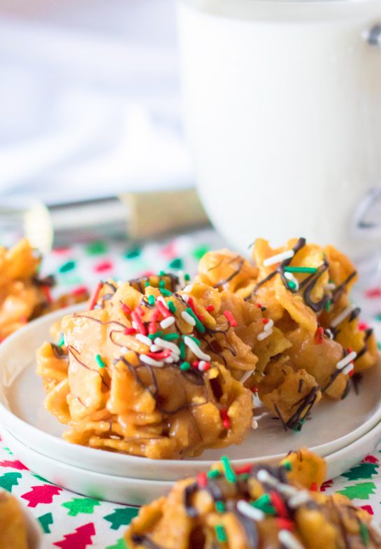 Frito Candy recipe is a creamy, gooey base of peanut butter candy gets tossed with salty Fritos for a fabulous treat for Christmas.  You will drizzle them with chocolate and top them with sprinkles and they are perfect for a holiday dessert tray or gifting.