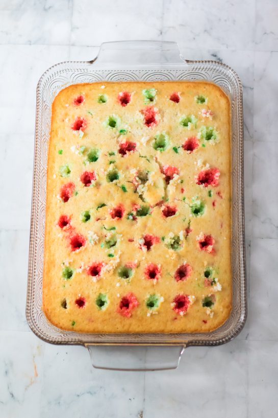 Photo of pouring the Jell-o mixture onto the Christmas Poke Cake