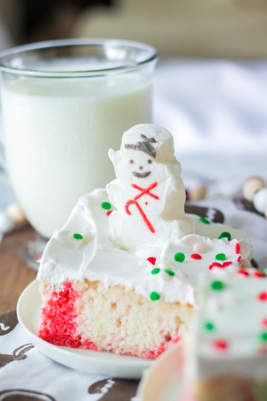 Photo of a slice of the finished Christmas Poke Cake recipe for the perfect holiday dessert