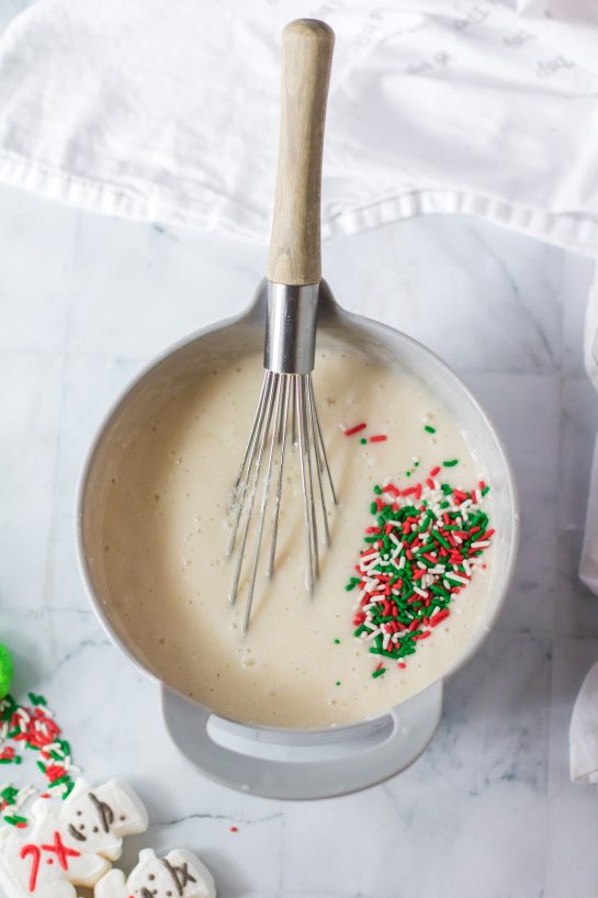 Photo of mixing the ingredients needed to make this Christmas Poke Cake recipe 