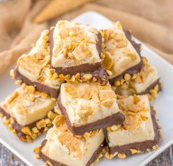 No-Bake Drumstick Ice Cream Fudge recipe inspired by the flavors of classic Drumstick ice cream cones. This is amazing, tasting just like the cones you ate as a child. Creamy fudge with crushed sugar cones on top, then dipped into a yummy chocolate and salted peanuts. Such a great, tasty and easy fudge!