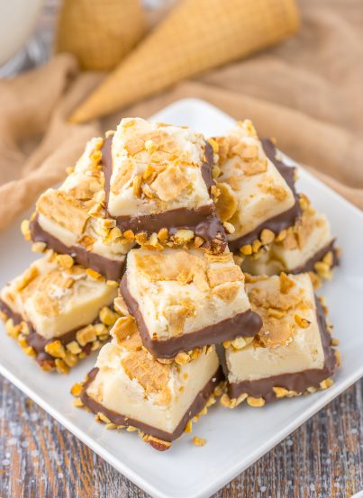 No-Bake Drumstick Ice Cream Fudge recipe inspired by the flavors of classic Drumstick ice cream cones. This is amazing, tasting just like the cones you ate as a child. Creamy fudge with crushed sugar cones on top, then dipped into a yummy chocolate and salted peanuts. Such a great, tasty and easy fudge!