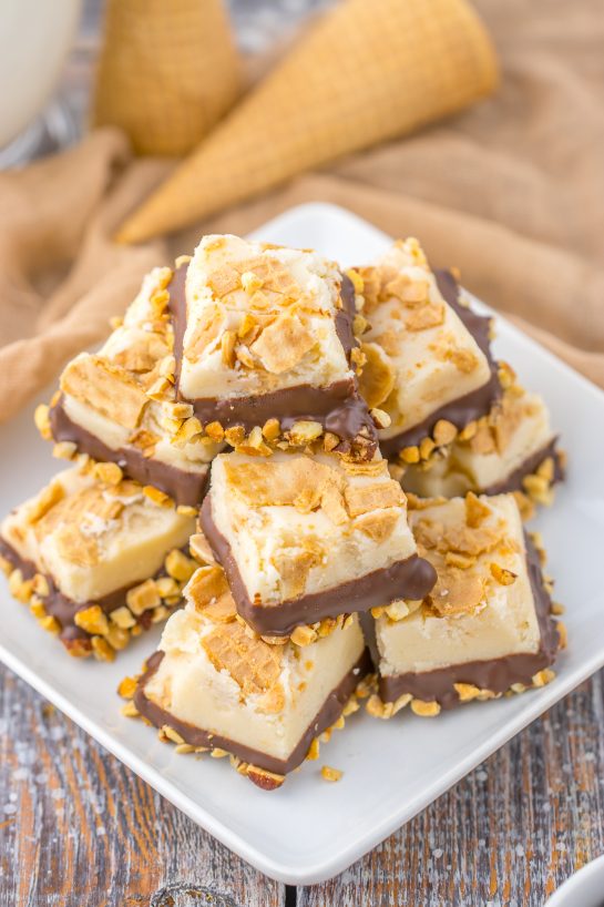 No-Bake Drumstick Ice Cream Fudge recipe inspired by the flavors of classic Drumstick ice cream cones. This is amazing, tasting just like the cones you ate as a child. Creamy fudge with crushed sugar cones on top, then dipped into a yummy chocolate and salted peanuts. Such a great, tasty and easy fudge!